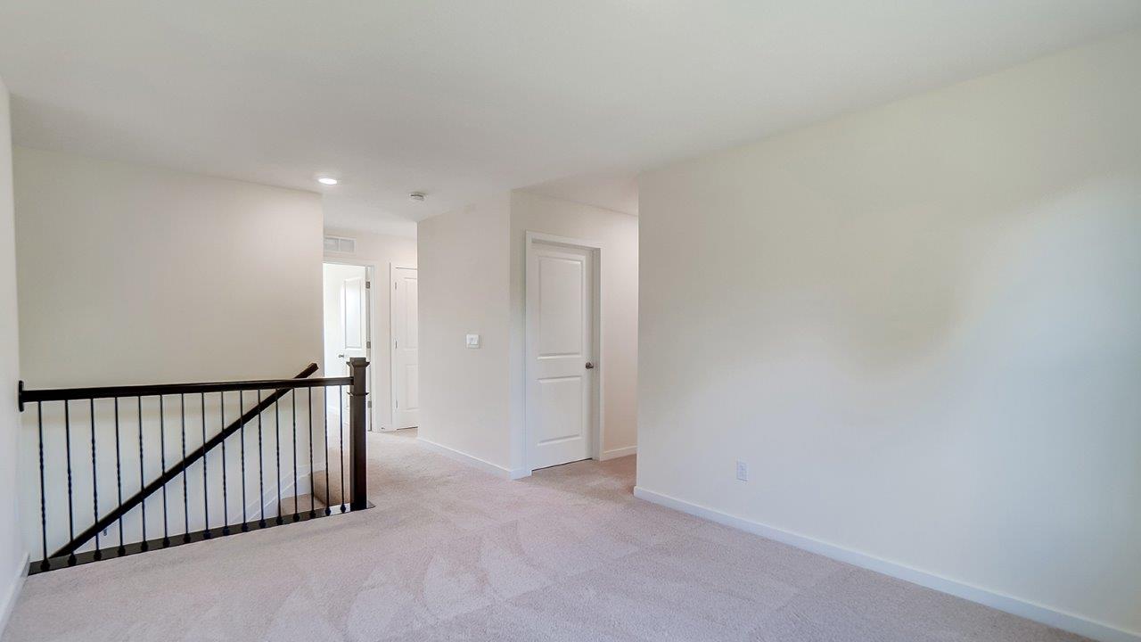 Open landing area at the top of the staircase.