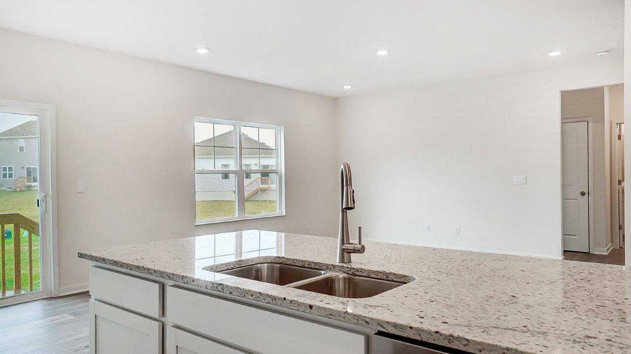 Kitchen island overlooking spacious living area.