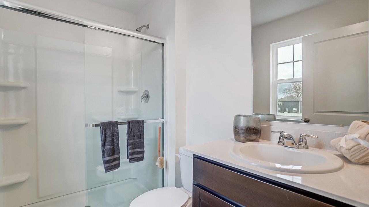Modern bathroom featuring a walk in shower.