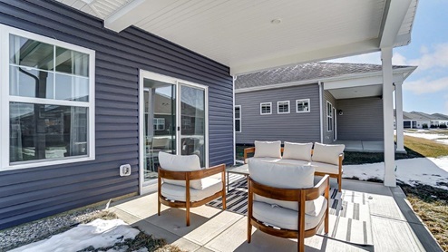 rear covered patio with seating