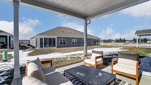 rear covered patio with seating