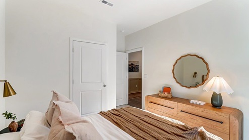 second bedroom bed, dresser and entry