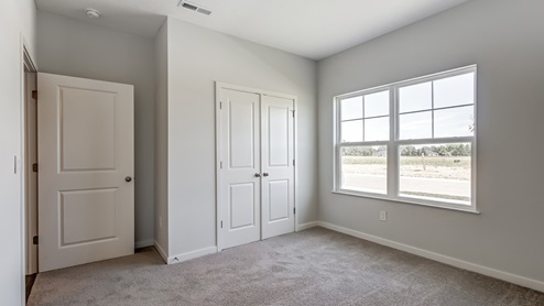 front bedroom with closet and double window