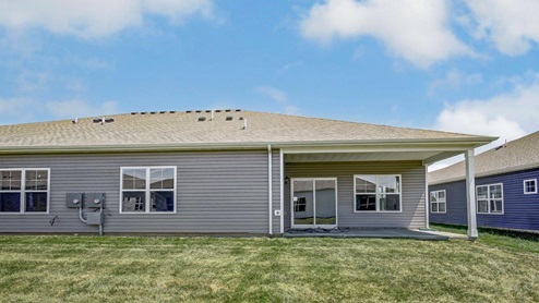 single story duplex with grey story rear exterior