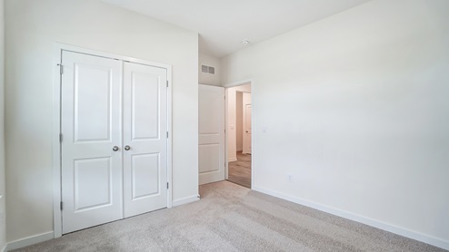 third bedroom closet and doorway