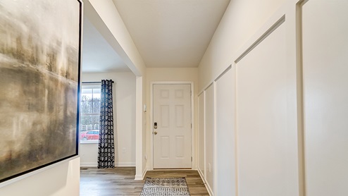 model home entry way with flex office space