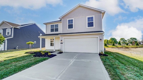 two story home with white siding, covered front porch and two car garage