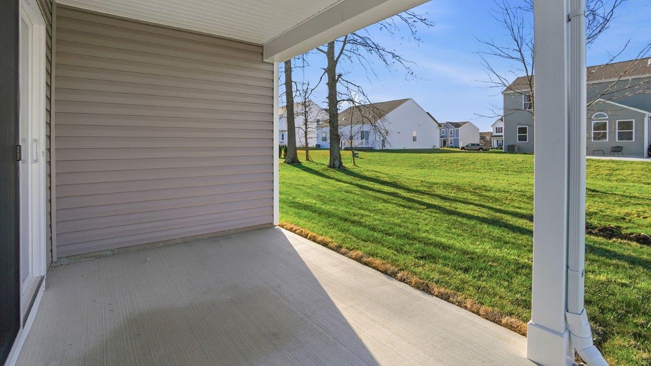 covered rear patio and back yard