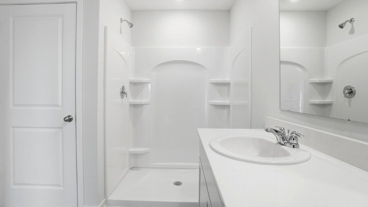 ensuite water closet, shower and vanity