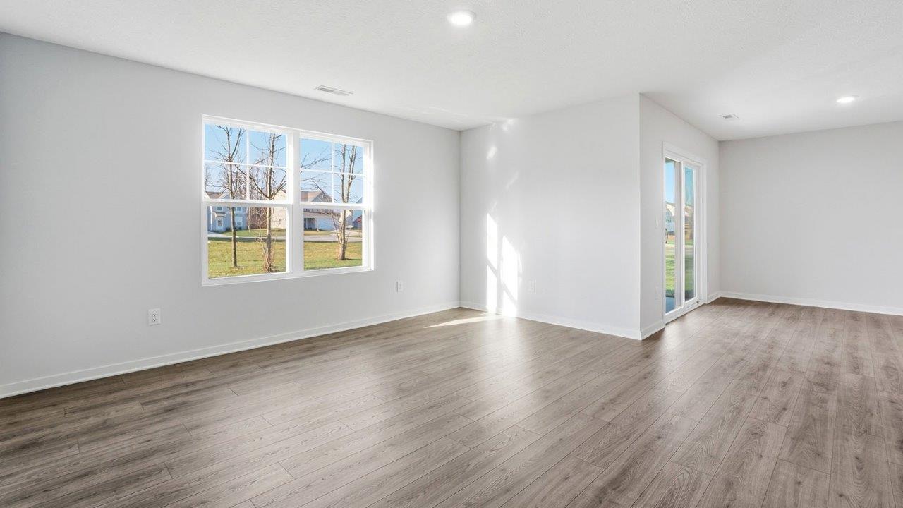 great room with double window and dining space