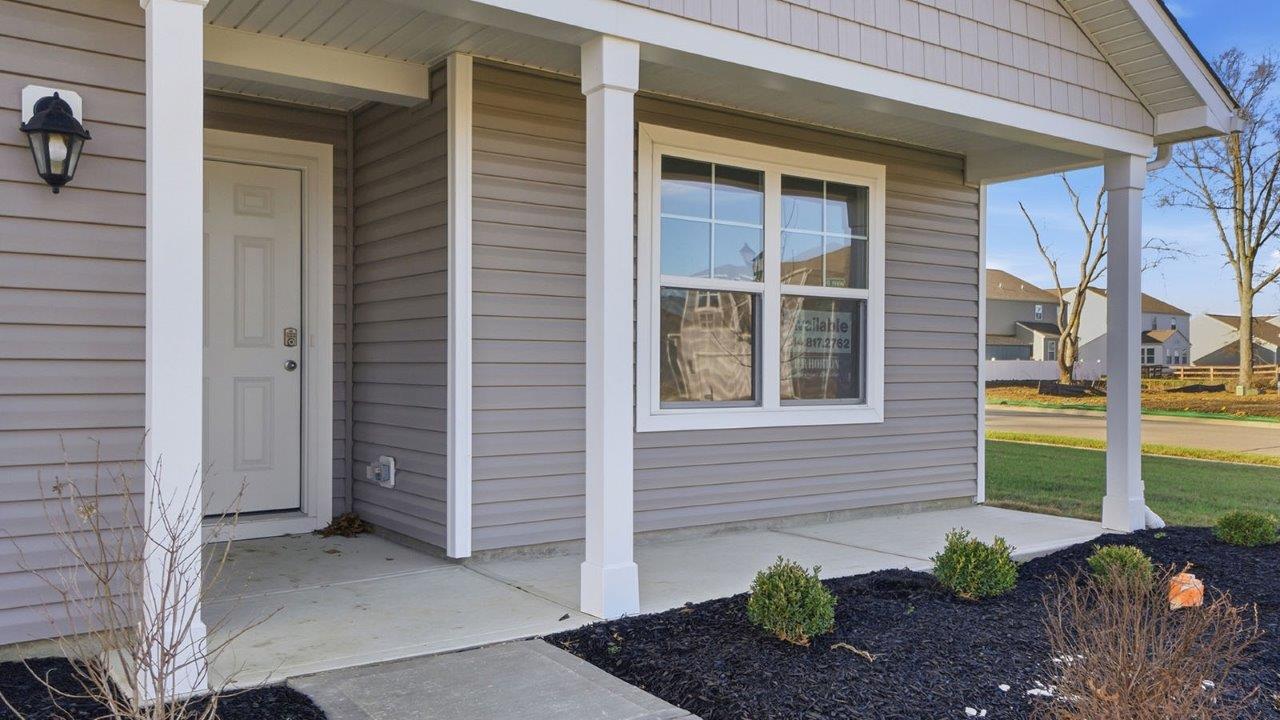 covered front porch with double window
