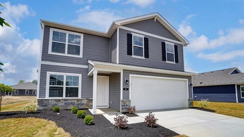 two story home with grey siding, covered entry, two car garage