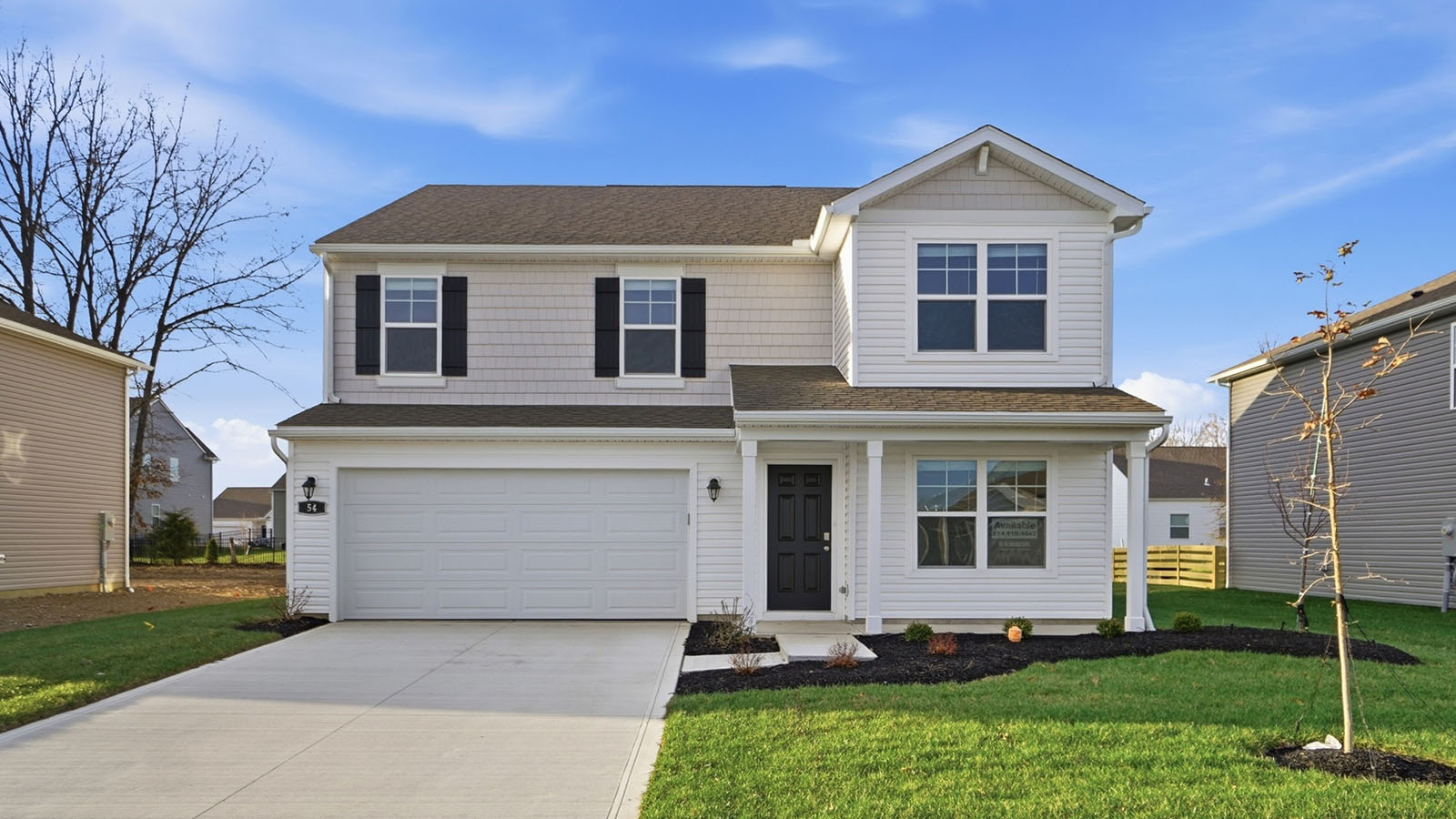two story home with grey siding, black shutters, covered front porch and two car garage