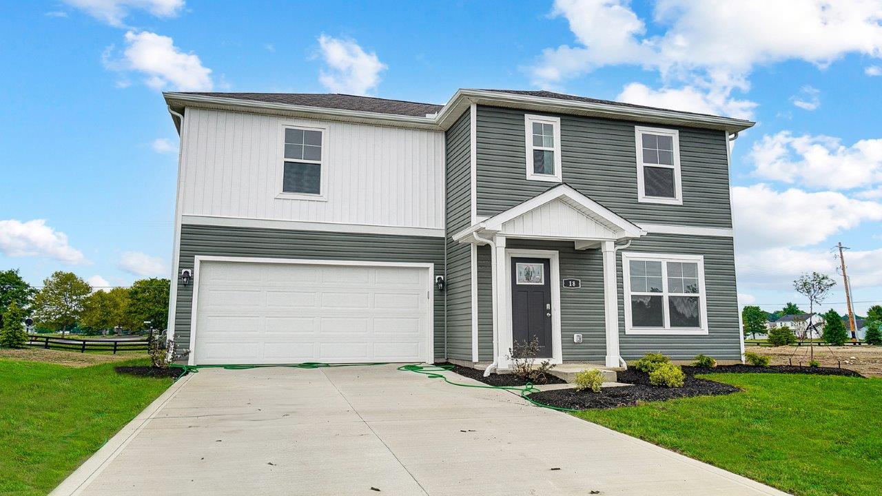 two story home with grey and white siding, two car garage