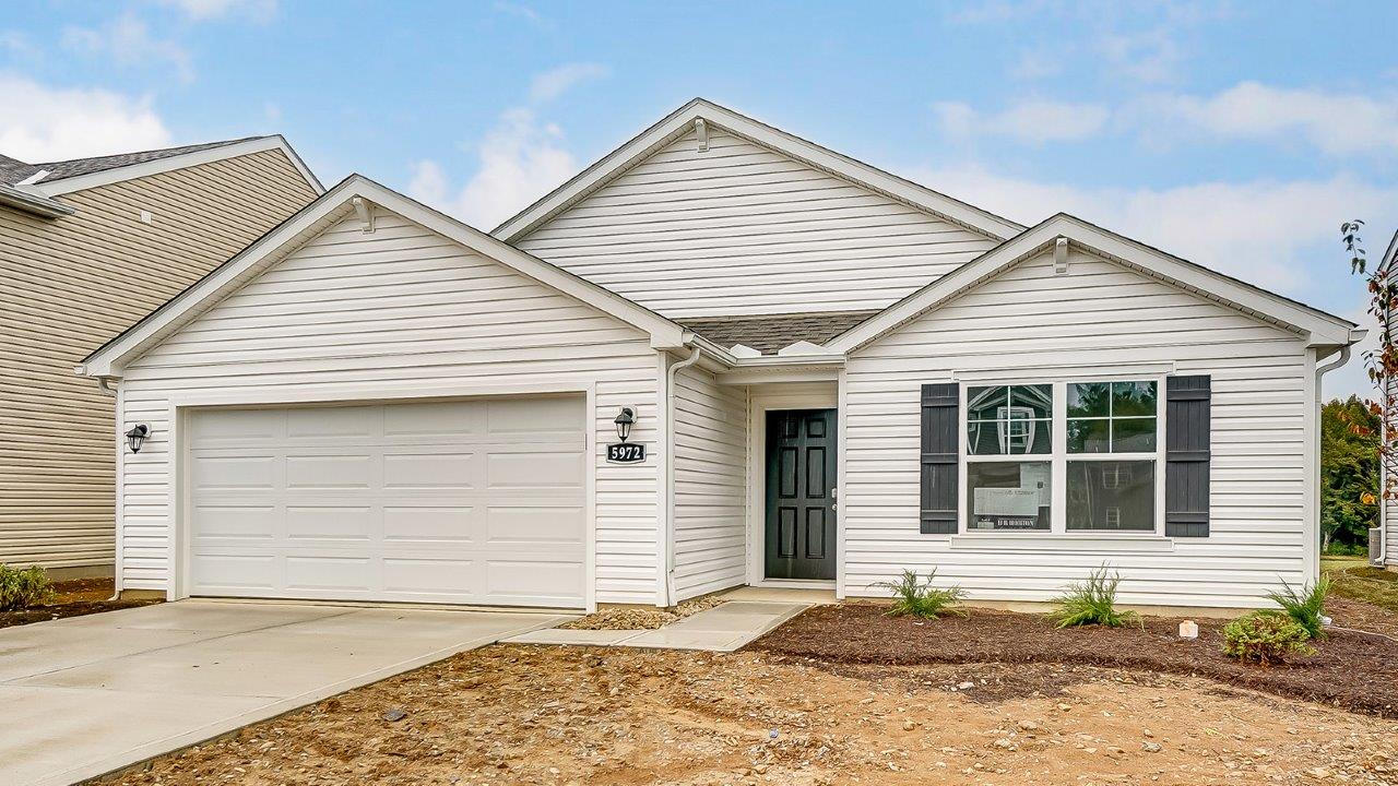 single story home with white siding and 2 car garage