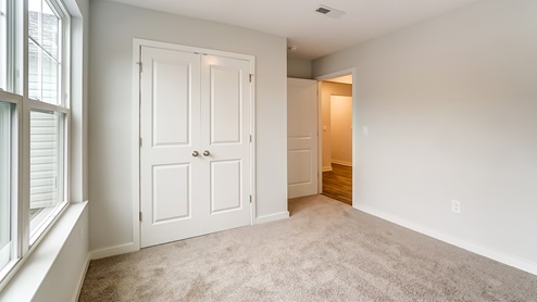 bedroom 2 with closet and entry