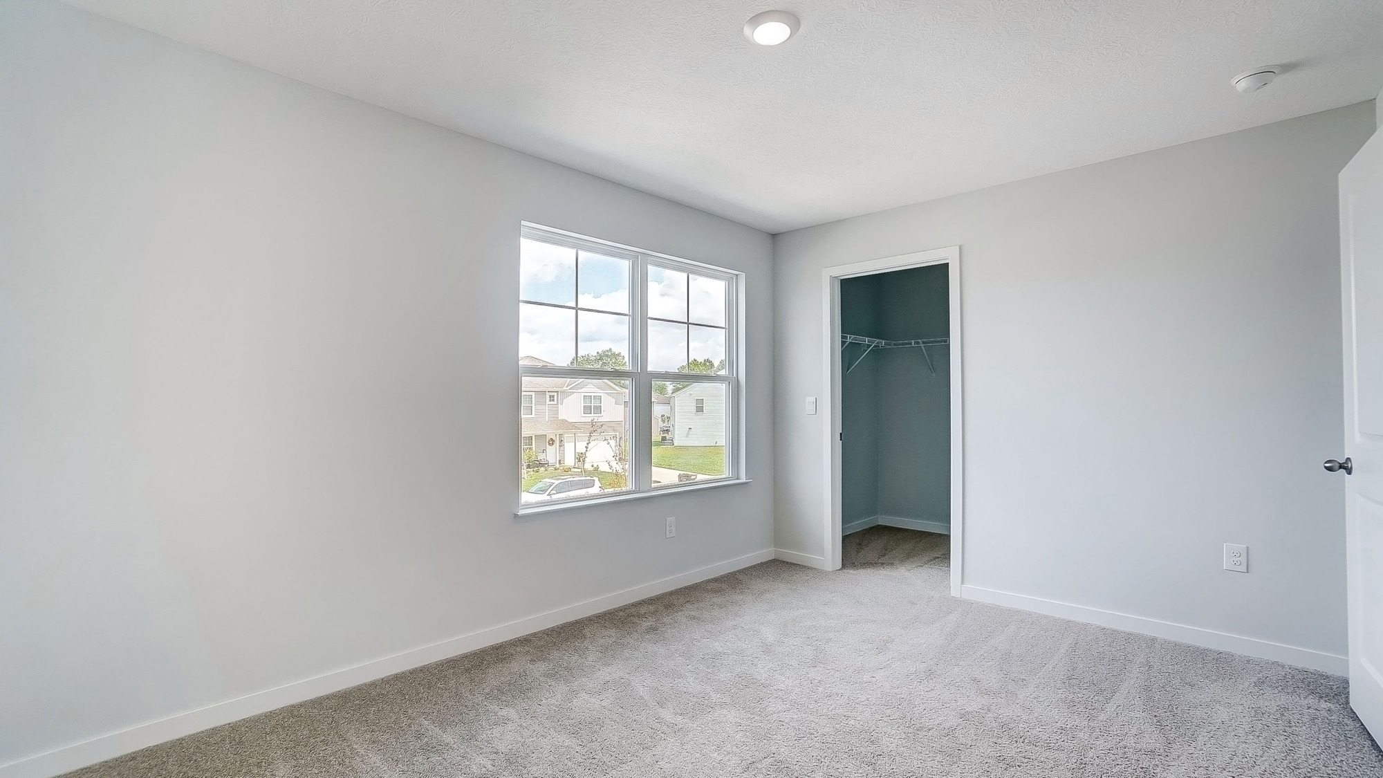 third bedroom with double window, closet