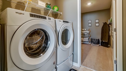 laundry room washer and dryer and walk in closet