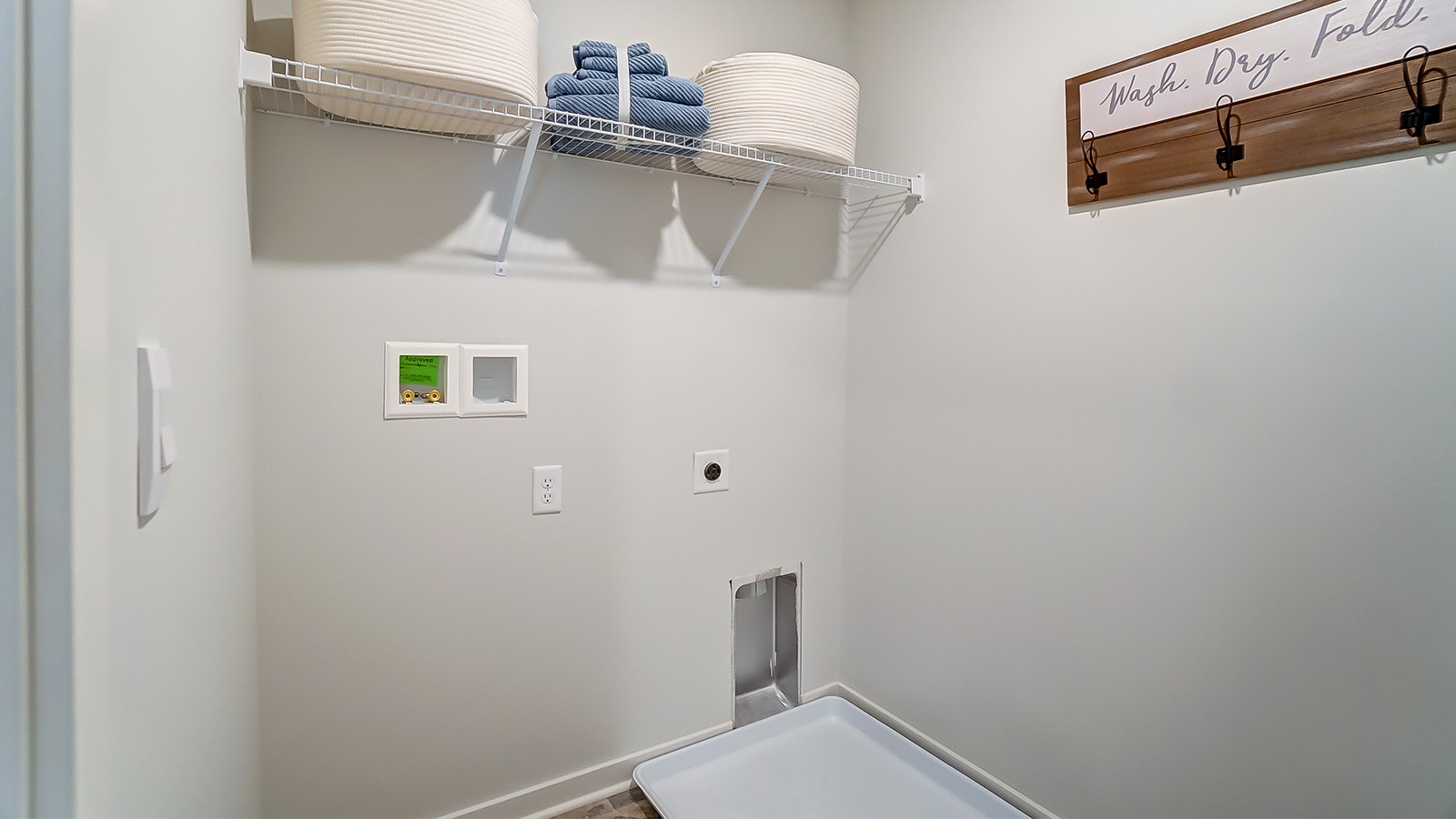 laundry room with wire shelving