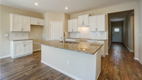 kitchen with white cabinets and island