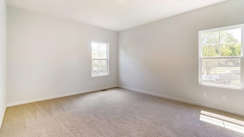 primary bedroom with single windows