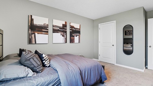 furnished fourth bedroom with walk in closet