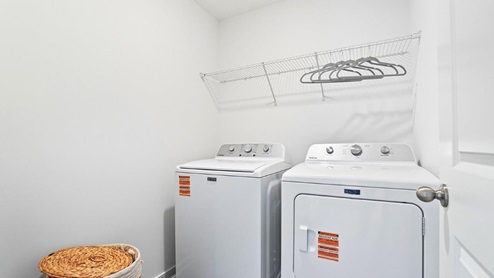 laundry room with washer, dryer and wire shelving
