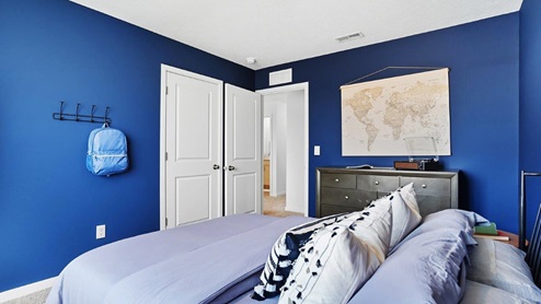 furnished third bedroom closet and entry