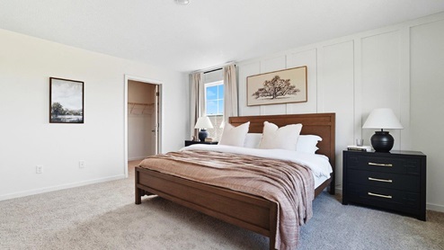 furnished primary bedroom with ensuite bath