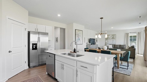 kitchen island, stainless steel appliances, corner pantry, dining room