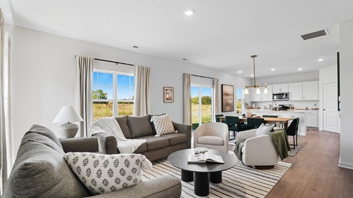 furnished great room, dining and kitchen