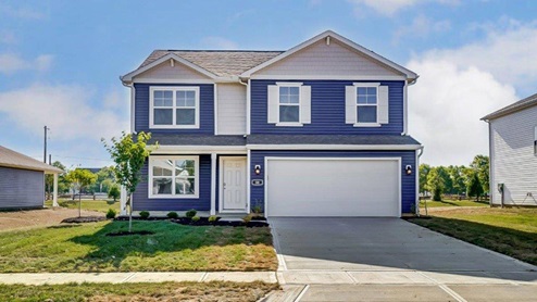 two story home with blue and grey siding, covered entry and two car garage