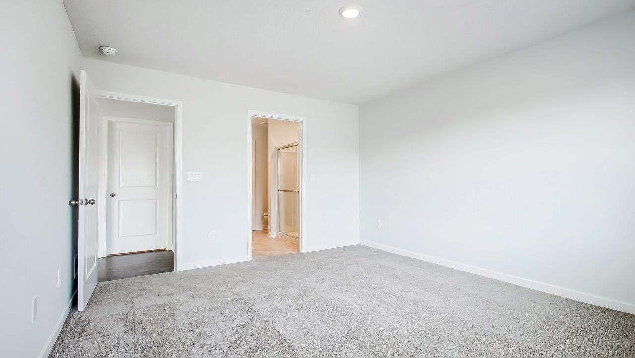 Primary bedroom designed with privacy and space in mind, a flow into a spa-inspired ensuite, walk-in closet on main level