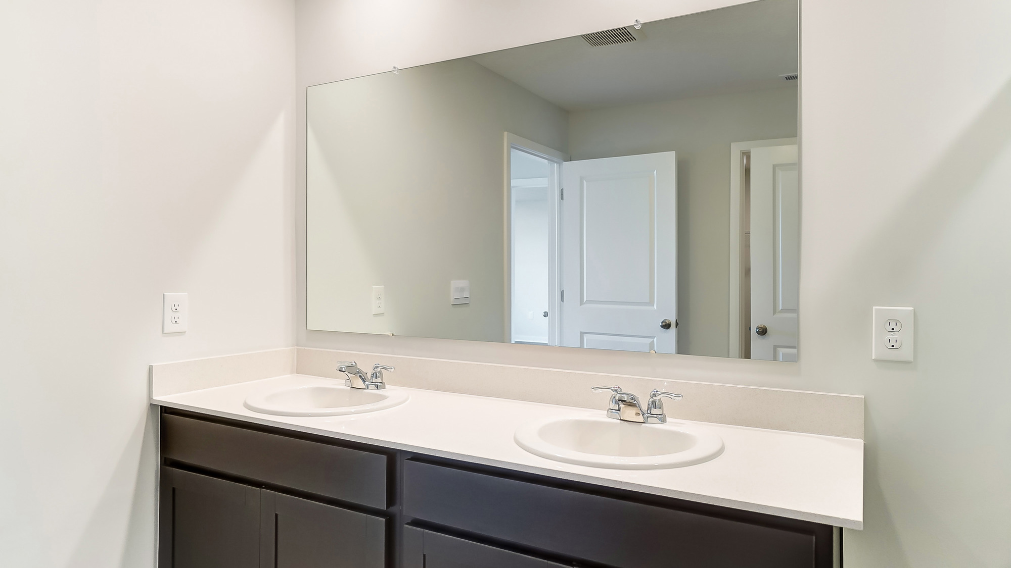 Owner’s ensuite in a new build home offers function and style with a walk-in closet, spa-like ensuite
