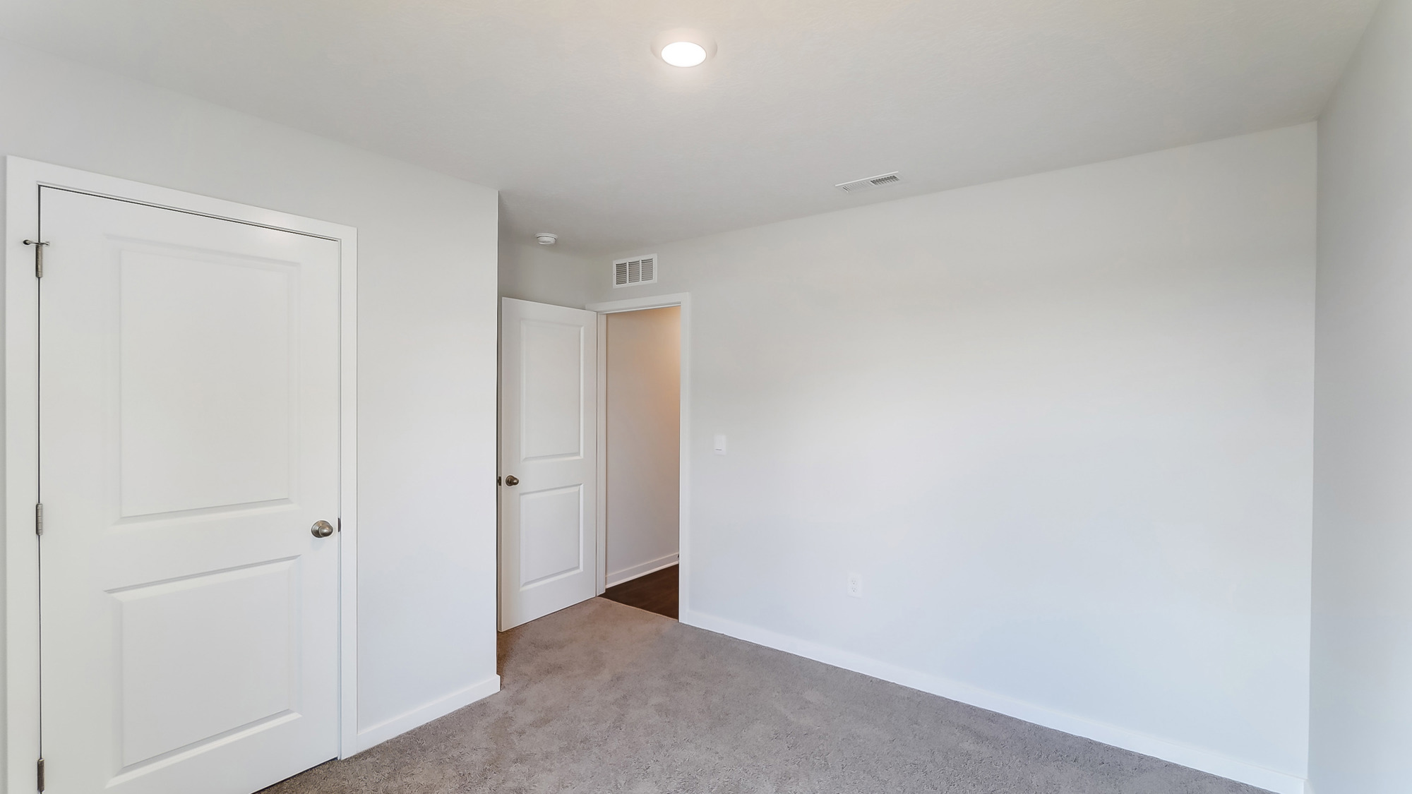 Third bedroom includes ample room space, flex room options, privacy from the primary suite, and a centrally accessible to home