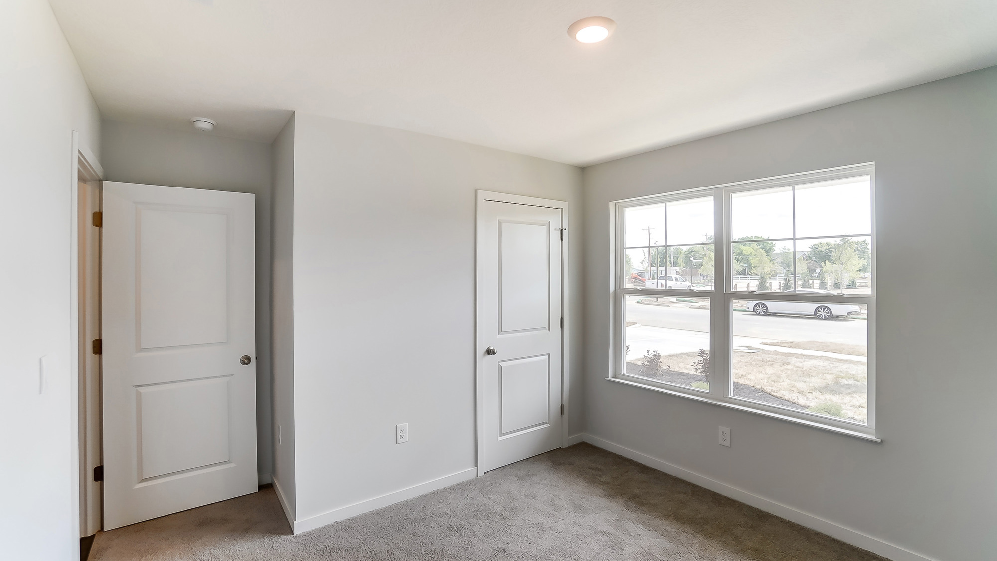 Third bedroom includes ample room space, flex room options, privacy from the primary suite, and a centrally accessible to home