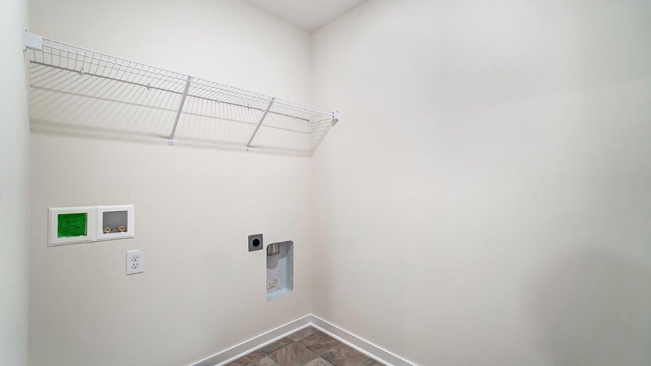 Lansdowne Farms utility laundry smartly designed with overhead organized storage, a drop zone, with new washer, dryer included