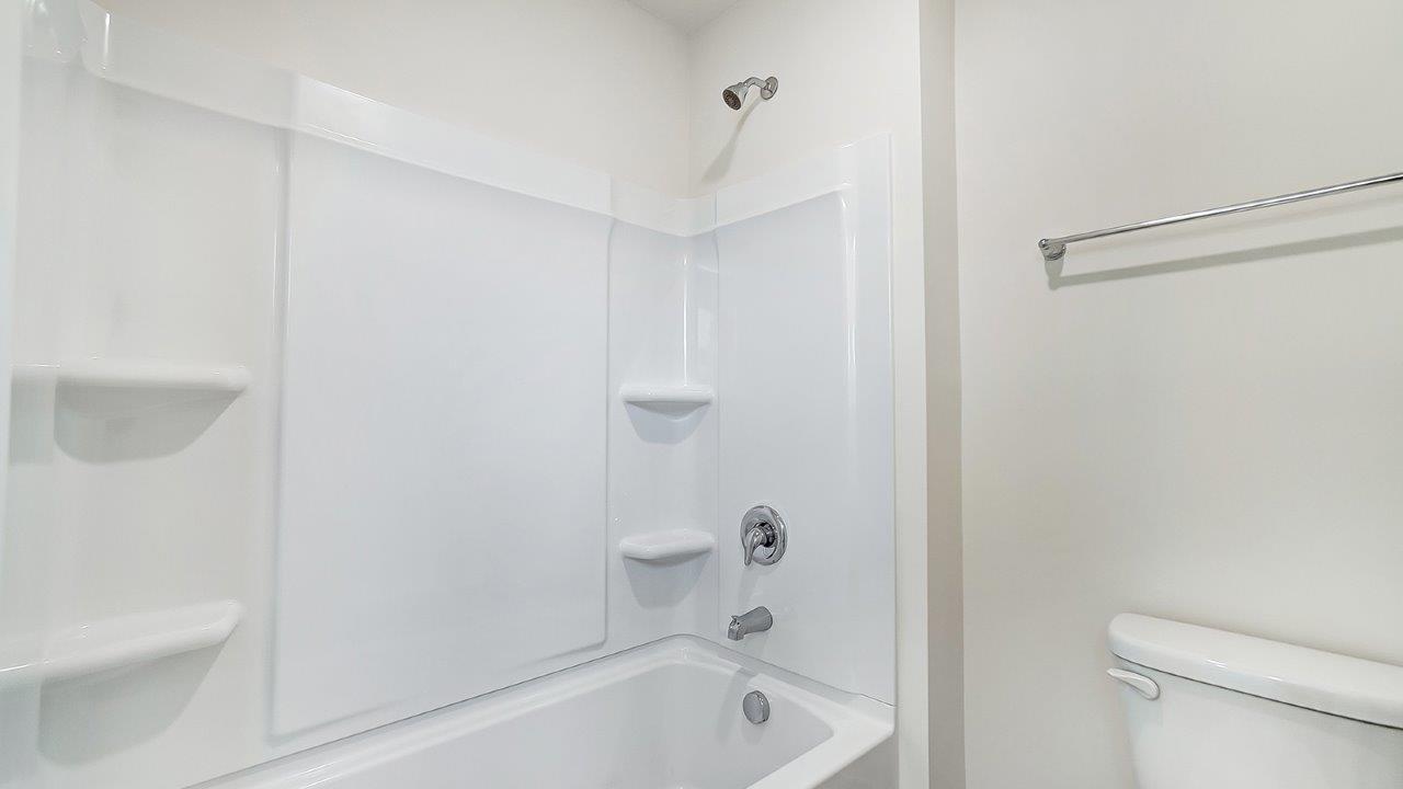 Owner’s ensuite in a new build home offers function and style with a walk-in closet, spa-like ensuite