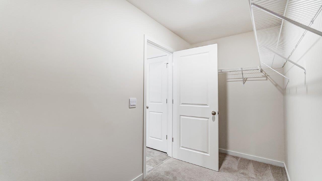 New home primary walk-in closet adds crafty organized space designed by D.R. Horton in Lansdowne Farms