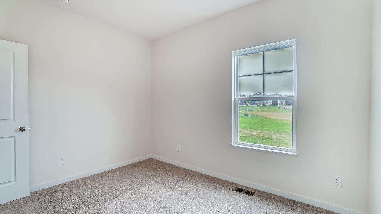 Second bedroom showcases space via single door closet, window, convenient home access to multi-use upstairs loft Lansdowne Farms