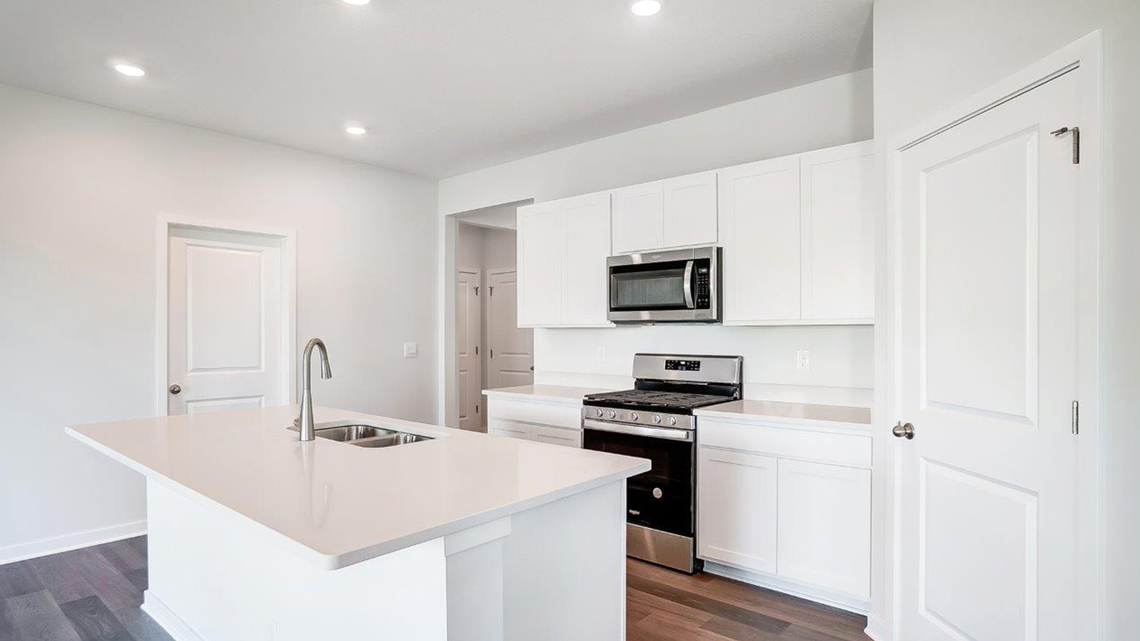 Central kitchen island adds a sink, seating, designed to anchor the home, pantry, prep zones, perfect for entertaining, everyday life
