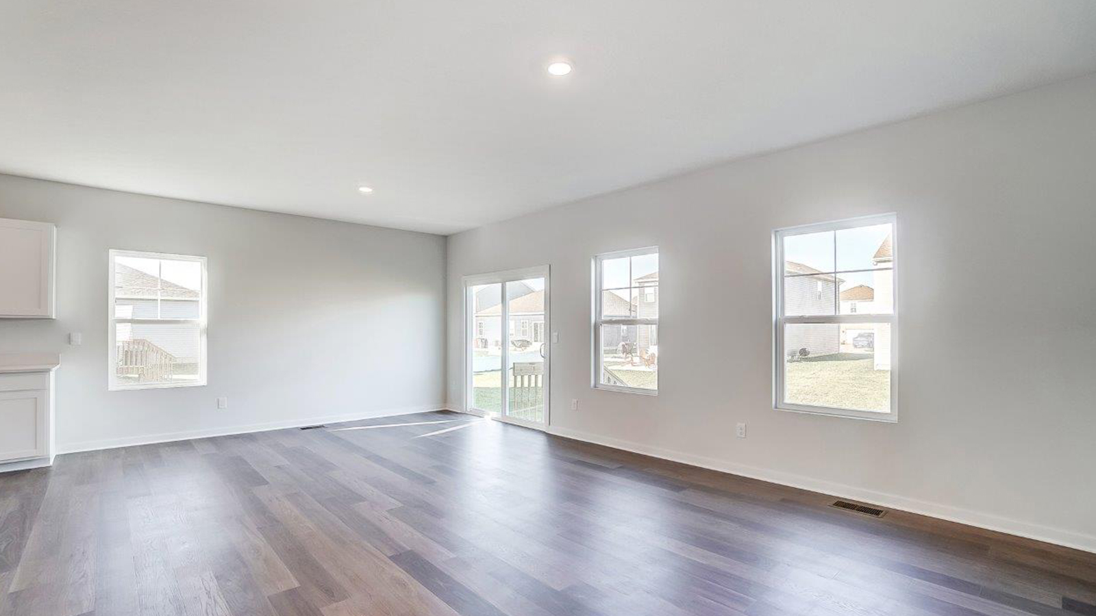 View from kitchen to the living room, backyard area, adding our fresh open design at Lansdowne Farms