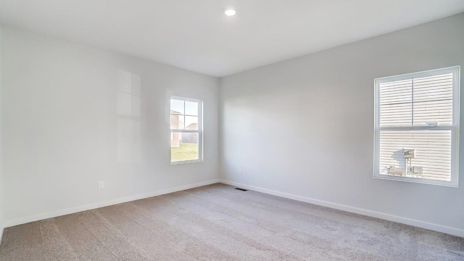 Primary bedroom designed for privacy and space with a convenient flow into spa-inspired ensuite bathroom and walk-in closet