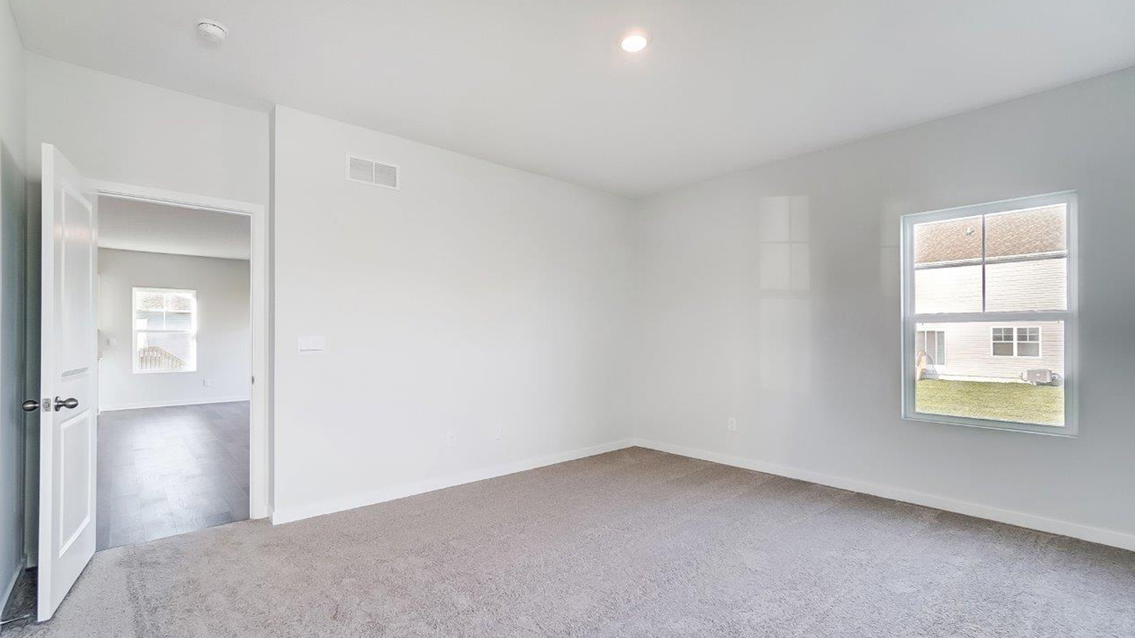 Owner’s suite offers natural window light, spa-inspired ensuite bathroom, backyard view, walk-in closet for everyday style