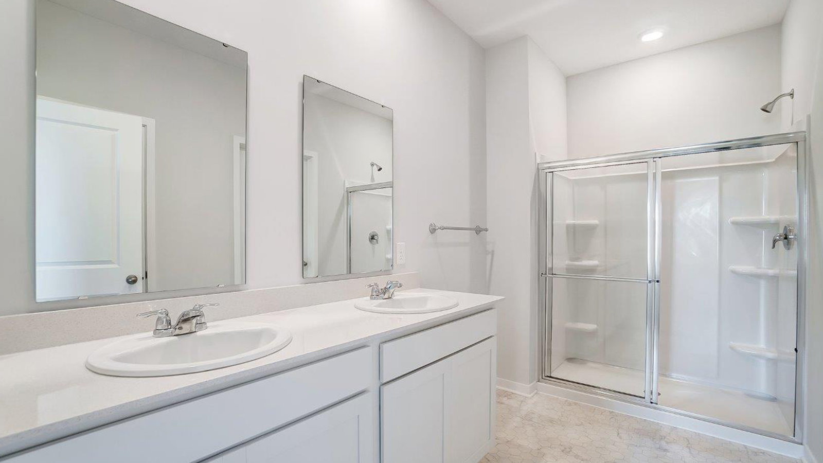New build home adds a thoughtful private ensuite, walk-in shower, walk-in closet, full vanity, mirror, backyard views