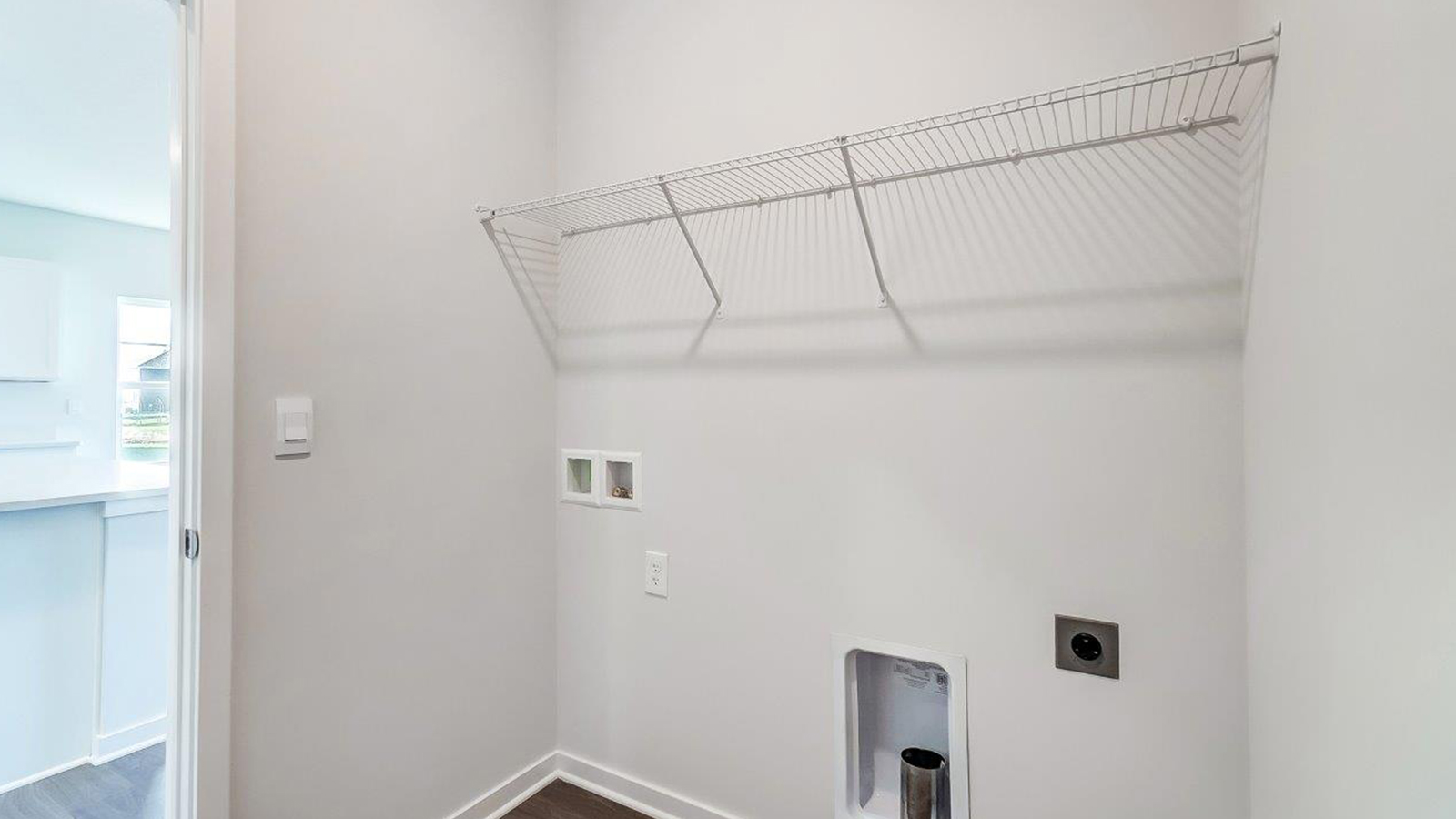 Lansdowne Farms utility laundry smartly designed with overhead organized storage, a drop zone, with new washer, dryer included