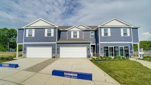 2 story 3 unit townhome with blue siding