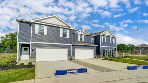 three 2 story townhome unit with blue siding