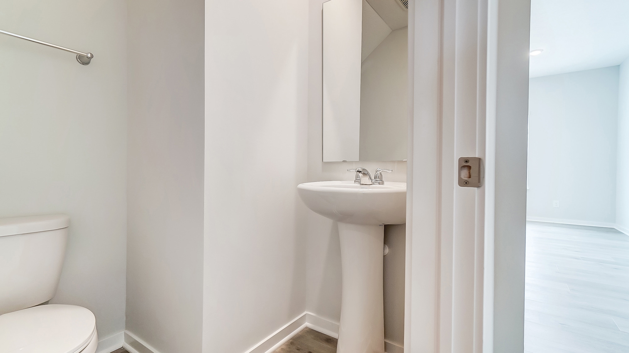 Half bath with a pedestal sink.