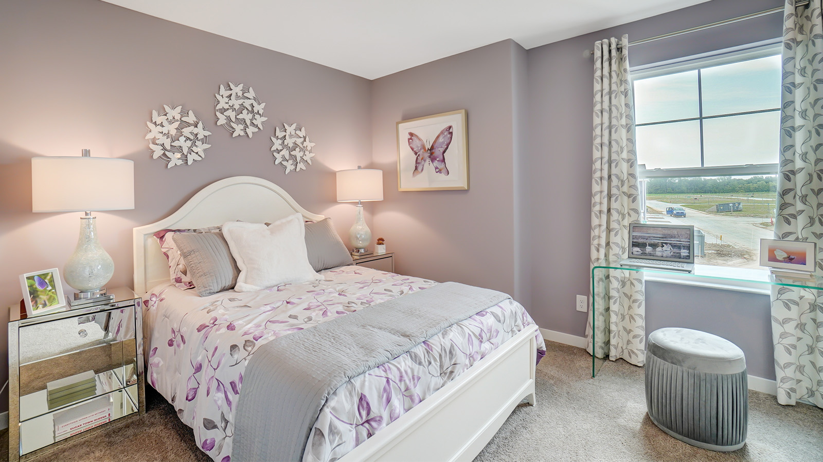 second bedroom with queen bed and night stands, desk with stool